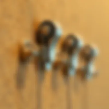 Close-Up of Adhesive Curtain Hooks on Textured Wall Close-up of adhesive curtain hooks on a textured wall