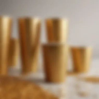 An eco-friendly setup displaying a variety of gold glitter plastic cups alongside biodegradable materials, highlighting sustainability.