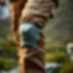 Close-up view of reinforced knee design in hiking pants.