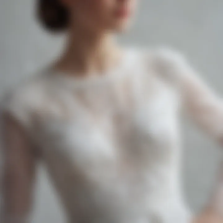 Close-up of intricate fabric details of a tight white dress, highlighting texture and quality.