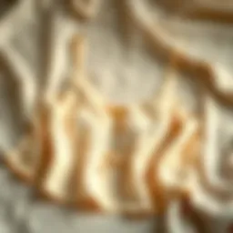 Elegant champagne camisole displayed on a soft fabric background