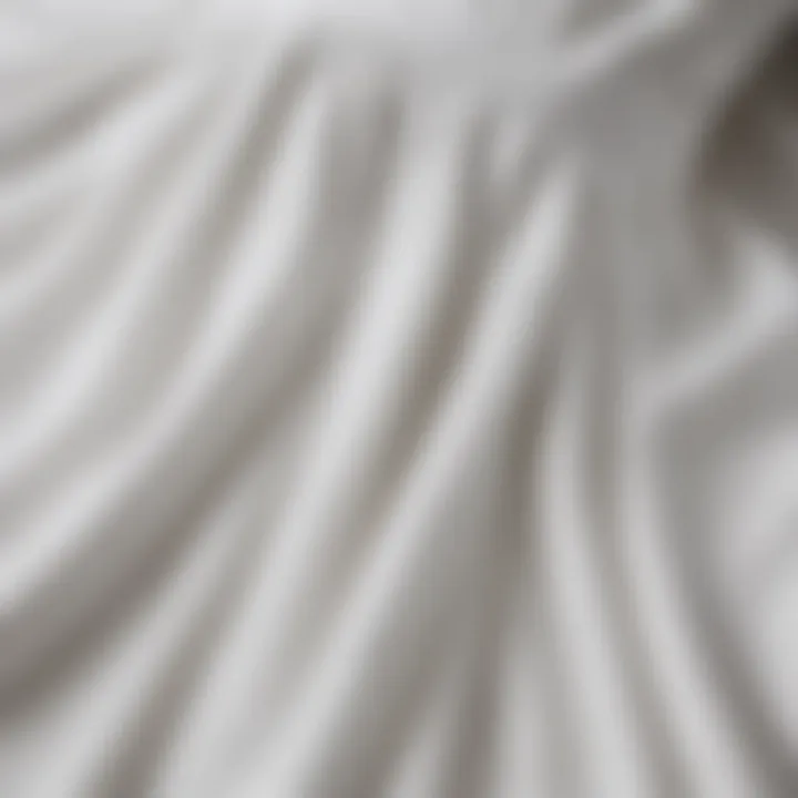 Close-up of fabric details of a knee-length white summer dress