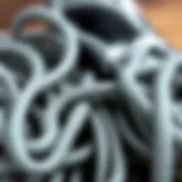 A collection of gray round shoelaces in various textures.