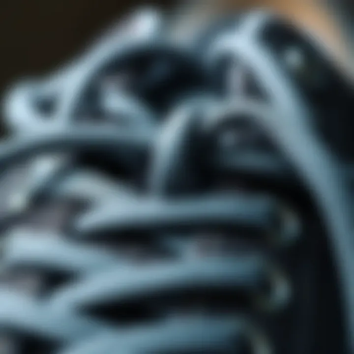 Artful Knotting of Gray Round Shoelaces Close-up of gray round shoelaces showing intricate knotting techniques.