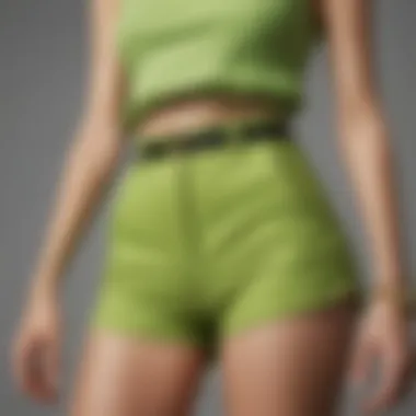 Close-up of lime green high waisted shorts paired with trendy accessories