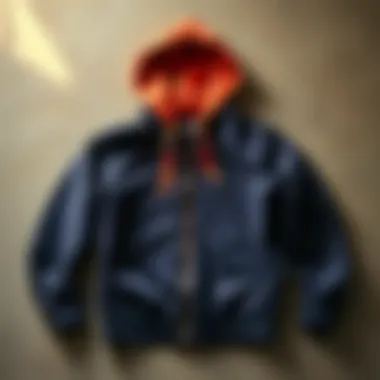 A stylish hoodie laying flat on a textured surface