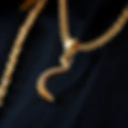 A close-up view of an elegant snake chain charm, showcasing its smooth, flowing design.