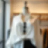 Elegant white flowy shirt styled with accessories on a mannequin