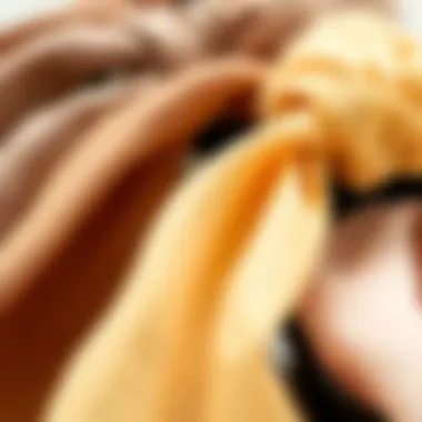 Close-up of fabric textures used in wide hair ties, highlighting different materials and their benefits.