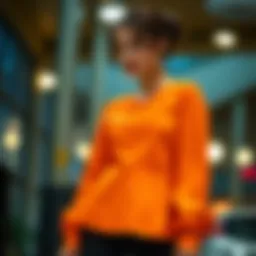 A stylish curved hem blouse showcased in a vibrant color.