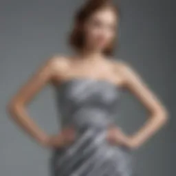 Elegant strapless striped dress showcased on a mannequin