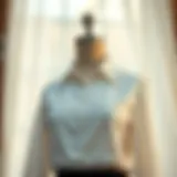 A classic white buttoned blouse elegantly styled on a mannequin