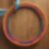 A vibrant weighted padded hula hoop on a wooden floor